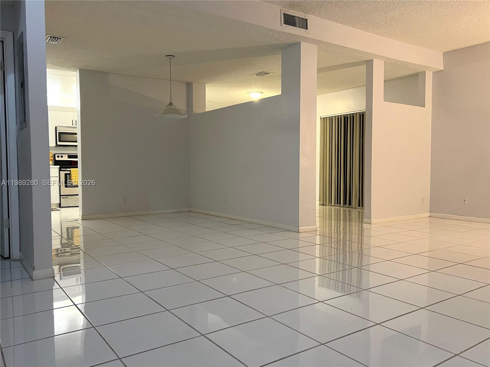 543 Racquet Club Road, Unit 33 Weston, FL 33326 - Photo 4 of 28 a view of an empty room
