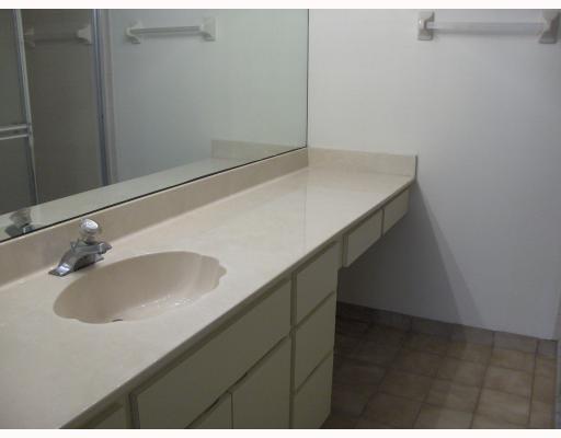 1950 Southwest Palm City Road, Unit 9104 Stuart, FL 34994 - Photo 5 of 8 a bathroom with a sink and a mirror