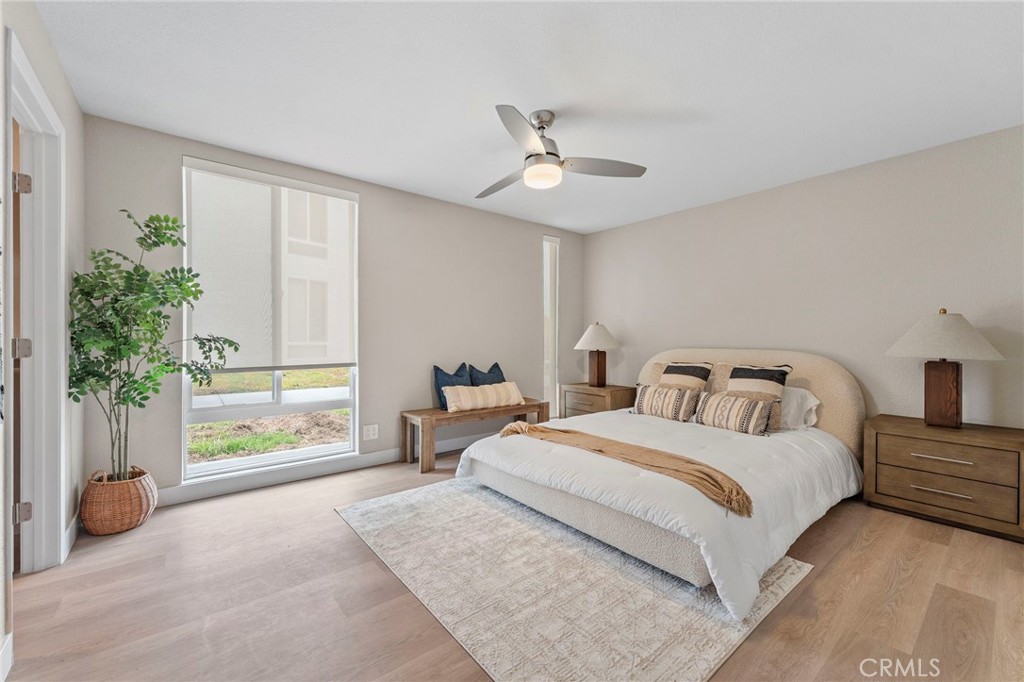 664 Tamarack Avenue, Unit 6 Carlsbad, CA 92008 - Photo 12 of 23 a bedroom with a bed and a window