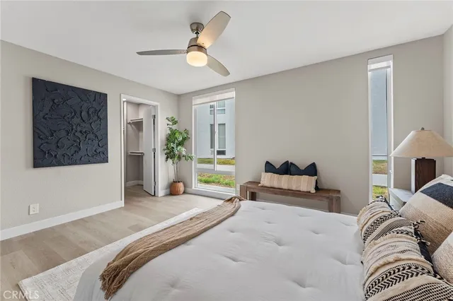 a bedroom with a large bed and a couch