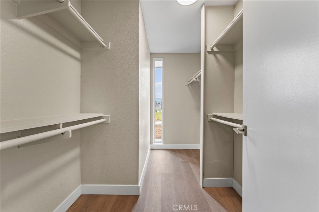 664 Tamarack Avenue, Unit 6 Carlsbad, CA 92008 - Photo 14 of 23 a view of walk in closet with empty racks