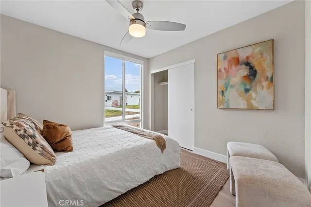 a bedroom with bed and a window