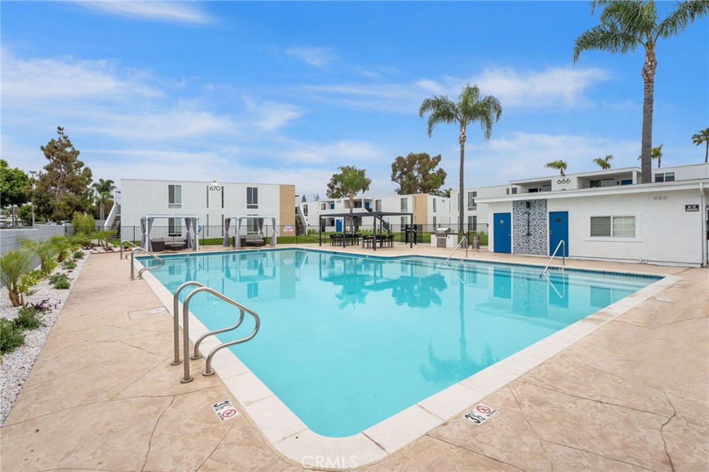 664 Tamarack Avenue, Unit 6 Carlsbad, CA 92008 - Photo 20 of 23 a view of a swimming pool with a patio