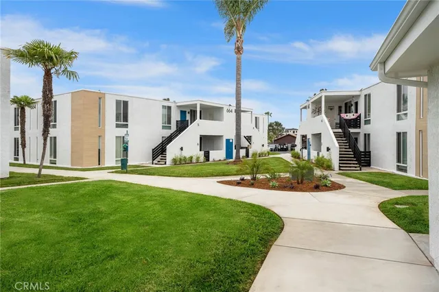 a front view of a house with a yard table and chairs