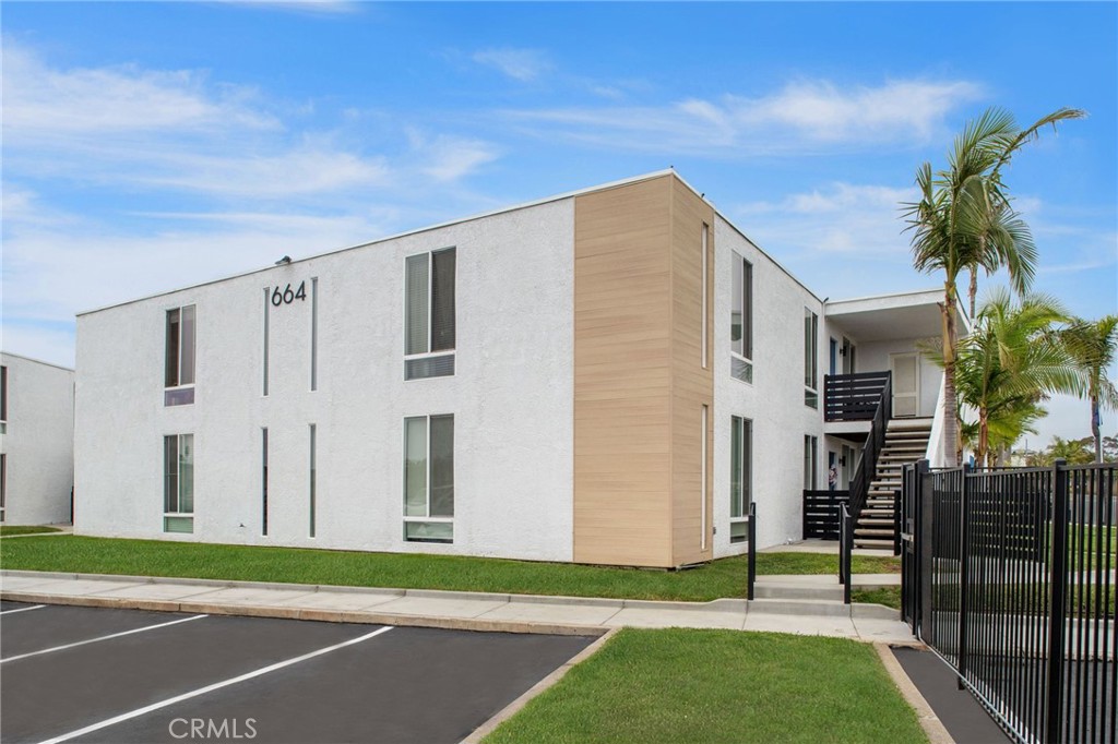 664 Tamarack Avenue, Unit 6 Carlsbad, CA 92008 - Photo 22 of 23 a view of a house with a yard