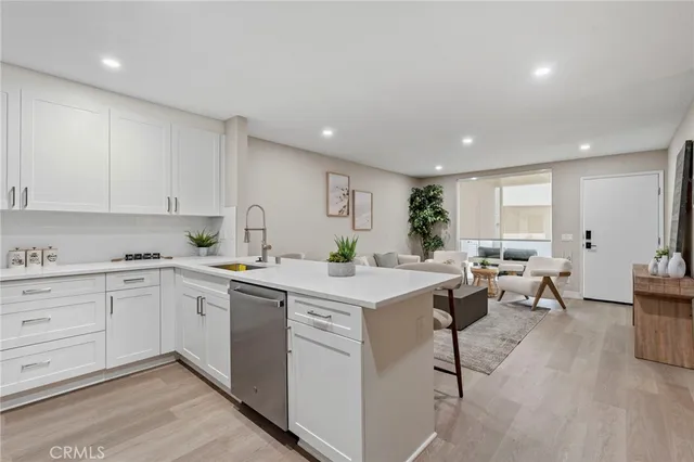 a view of kitchen with center island and stainless steel appliances