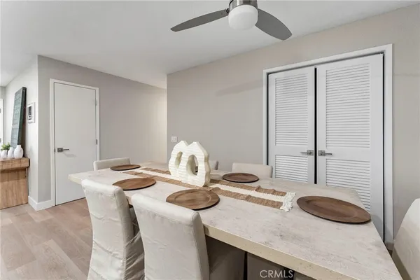 a dining room with furniture and wooden floor