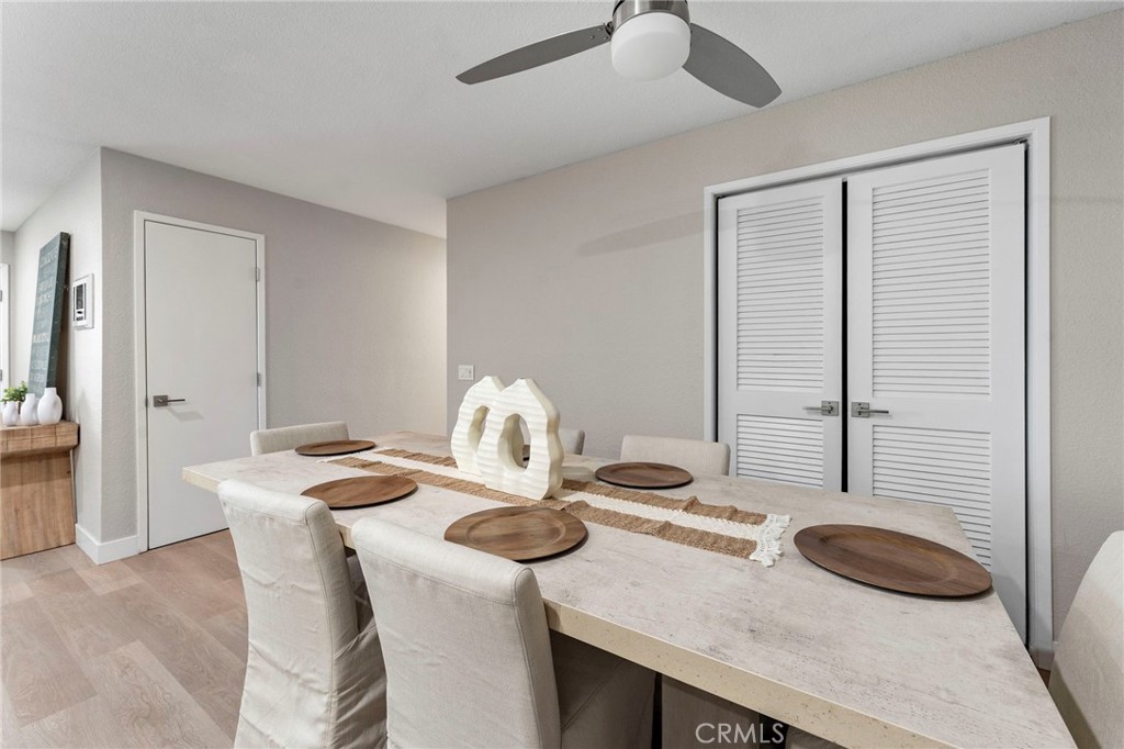 664 Tamarack Avenue, Unit 6 Carlsbad, CA 92008 - Photo 10 of 23 a dining room with furniture and wooden floor