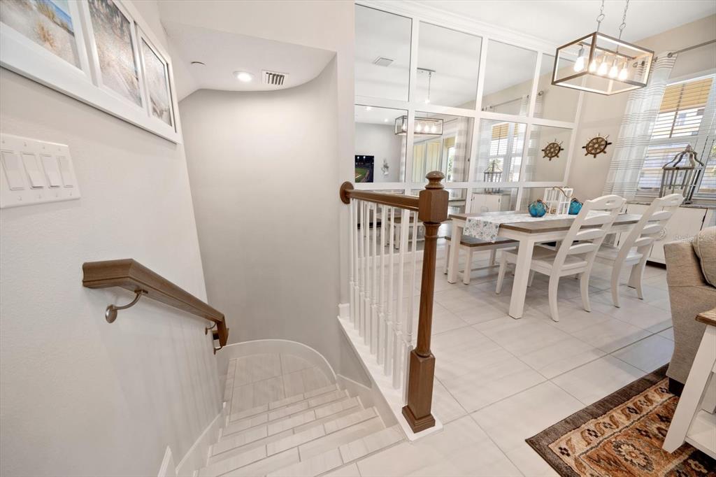 2516 Coral Court Indian Rocks Beach, FL 33785 - Photo 14 of 69 a dining room with furniture and a chandelier