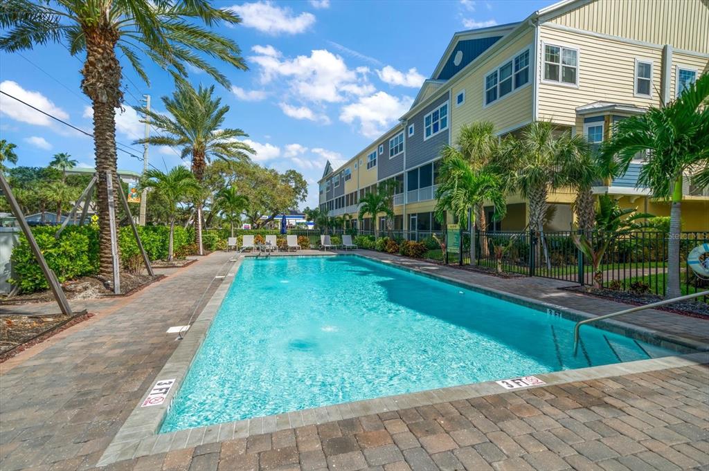 2516 Coral Court Indian Rocks Beach, FL 33785 - Photo 25 of 69 a view of a yard with plants and palm trees