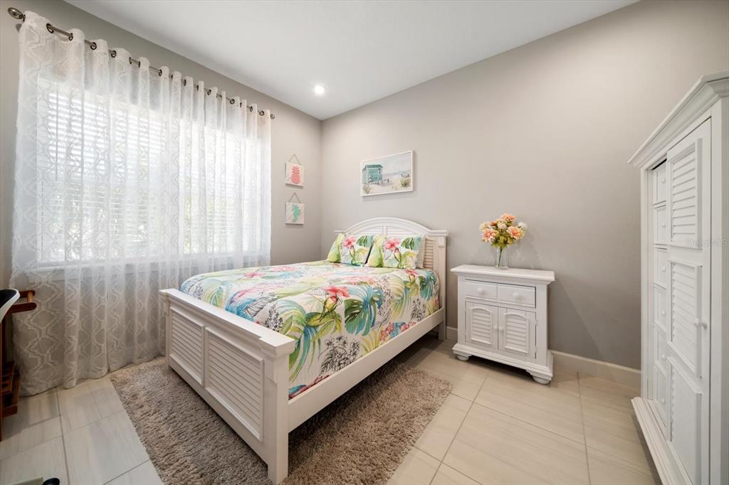 2516 Coral Court Indian Rocks Beach, FL 33785 - Photo 38 of 69 a bedroom with a bed and window