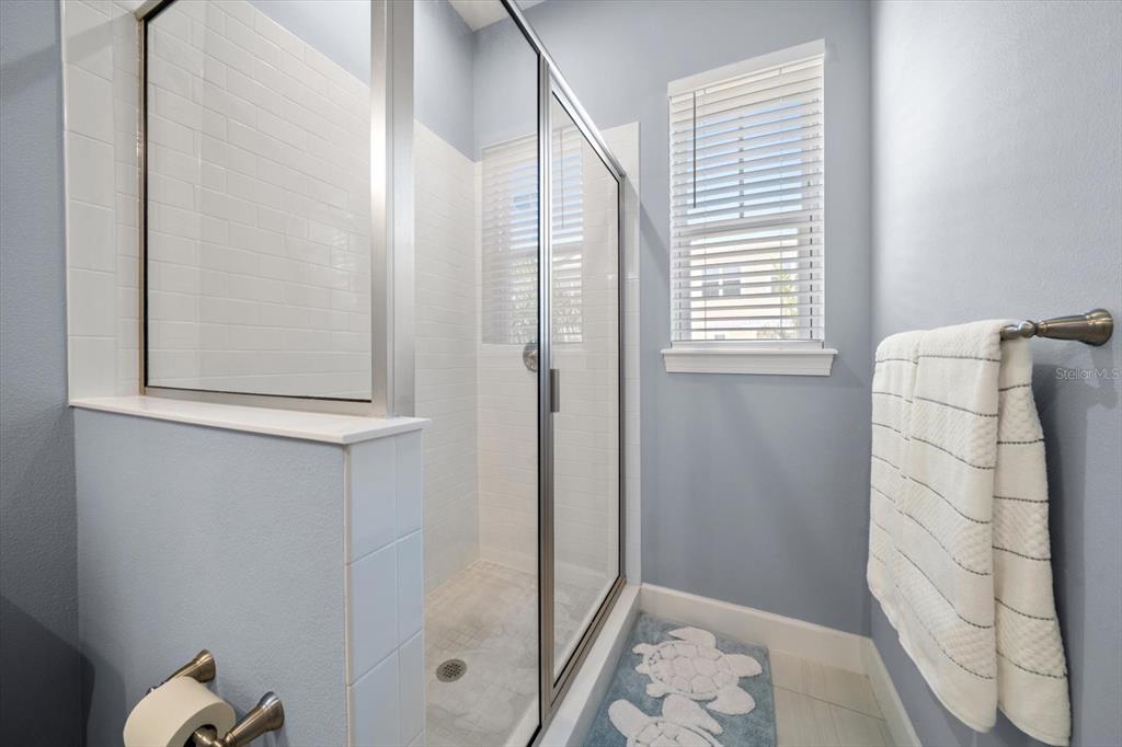 2516 Coral Court Indian Rocks Beach, FL 33785 - Photo 42 of 69 a bathroom with a shower and a sink