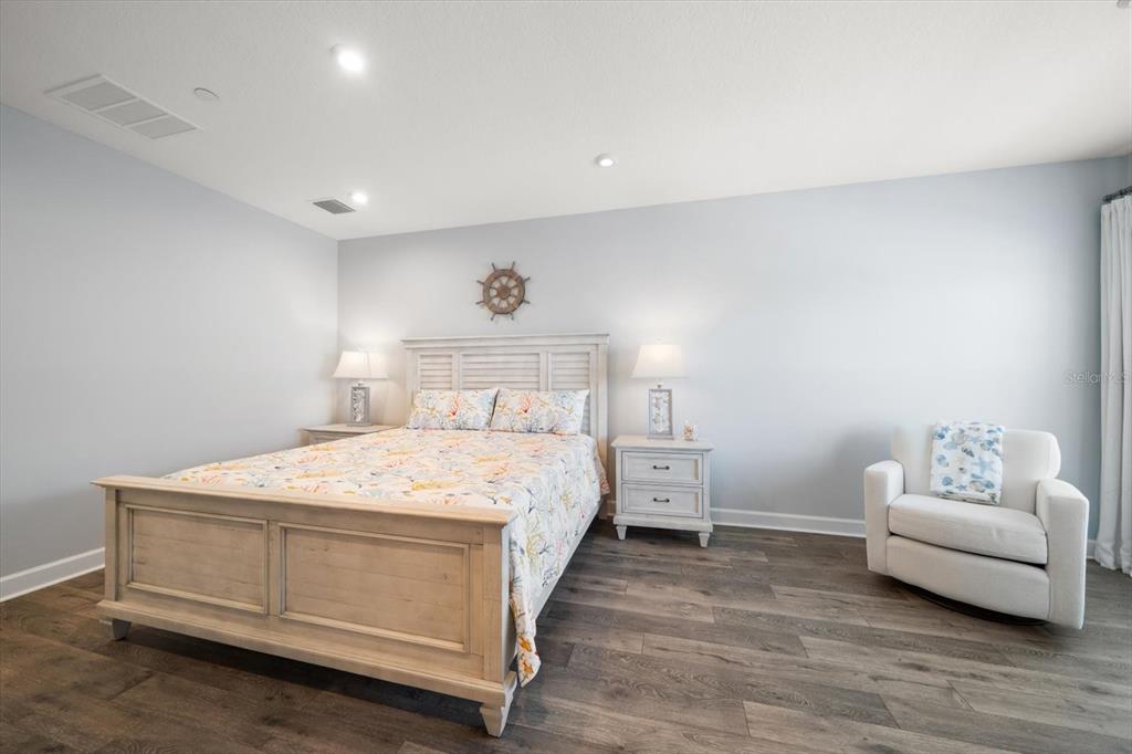 2516 Coral Court Indian Rocks Beach, FL 33785 - Photo 43 of 69 a bedroom with a bed and a couch