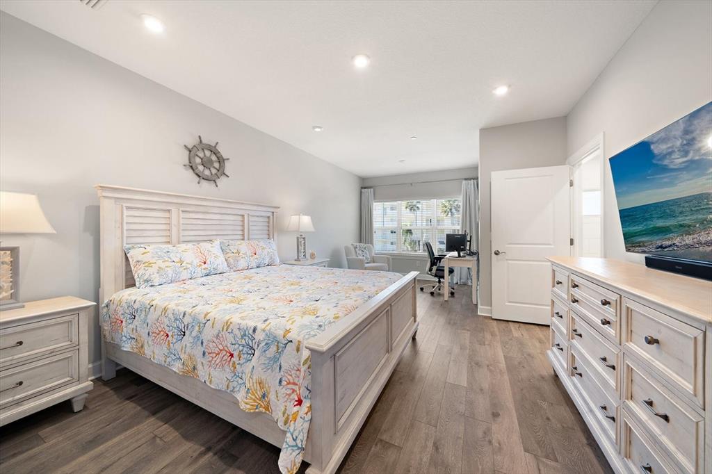 2516 Coral Court Indian Rocks Beach, FL 33785 - Photo 48 of 69 a bedroom with a bed and a flat screen tv