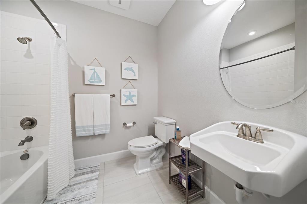 2516 Coral Court Indian Rocks Beach, FL 33785 - Photo 51 of 69 a bathroom with a sink toilet and shower