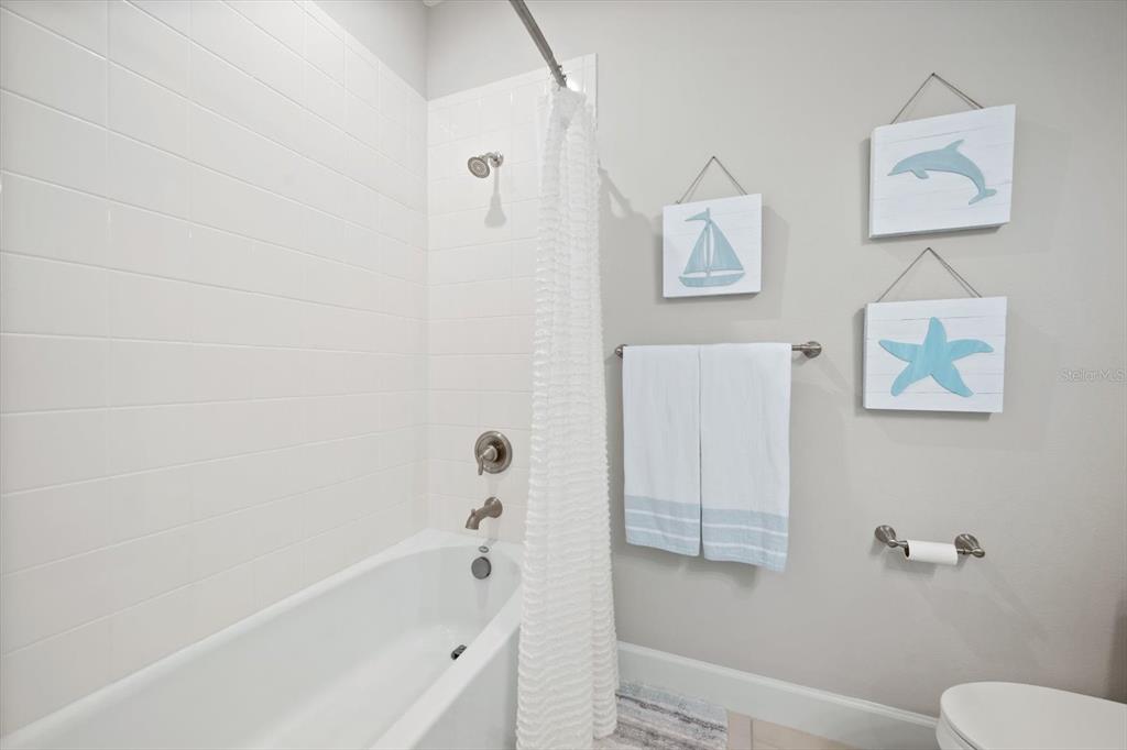 2516 Coral Court Indian Rocks Beach, FL 33785 - Photo 52 of 69 a bathroom with a bathtub and shower