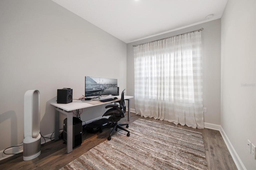 2516 Coral Court Indian Rocks Beach, FL 33785 - Photo 54 of 69 a view of a workspace with furniture and a window