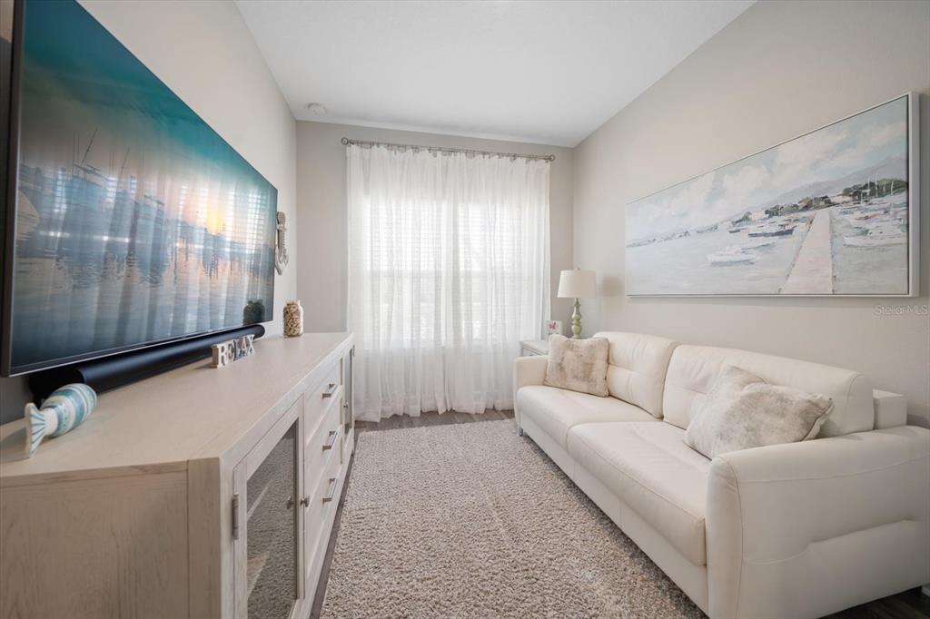 2516 Coral Court Indian Rocks Beach, FL 33785 - Photo 56 of 69 a living room with furniture and a window