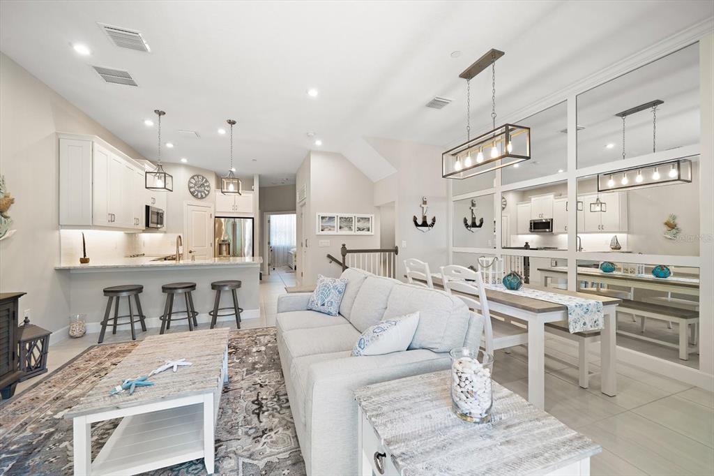 2516 Coral Court Indian Rocks Beach, FL 33785 - Photo 8 of 69 a kitchen with stainless steel appliances kitchen island granite countertop a sink and cabinets