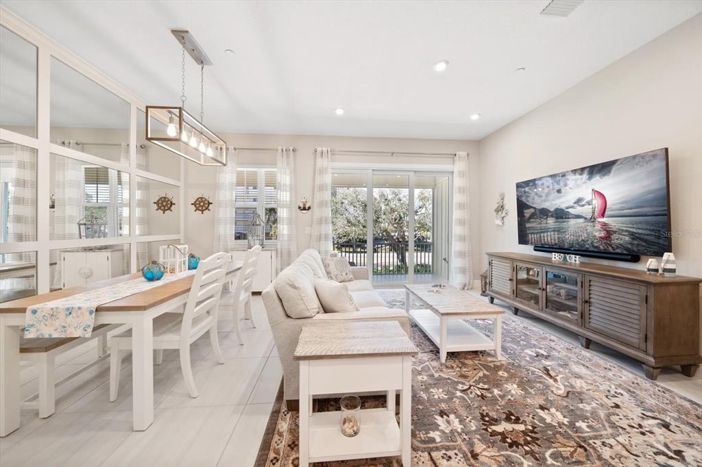 2516 Coral Court Indian Rocks Beach, FL 33785 - Photo 10 of 69 a living room with furniture and a flat screen tv