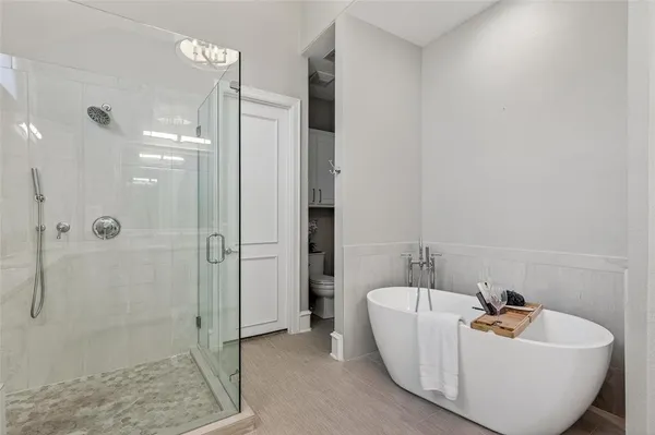 a bathroom with a sink a window and shower
