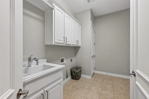 a bathroom with a sink and cabinets