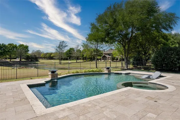 a view of a swimming pool with a lounge chairs