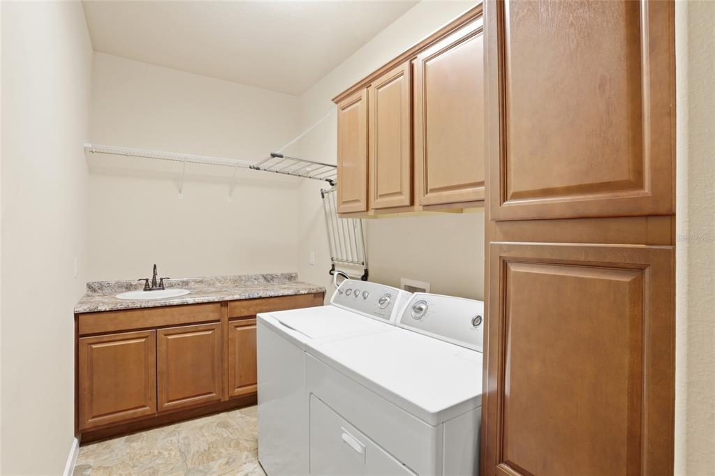 877 Haring Lane Mount Dora, FL 32757 - Photo 13 of 26 a utility room with dryer and washer