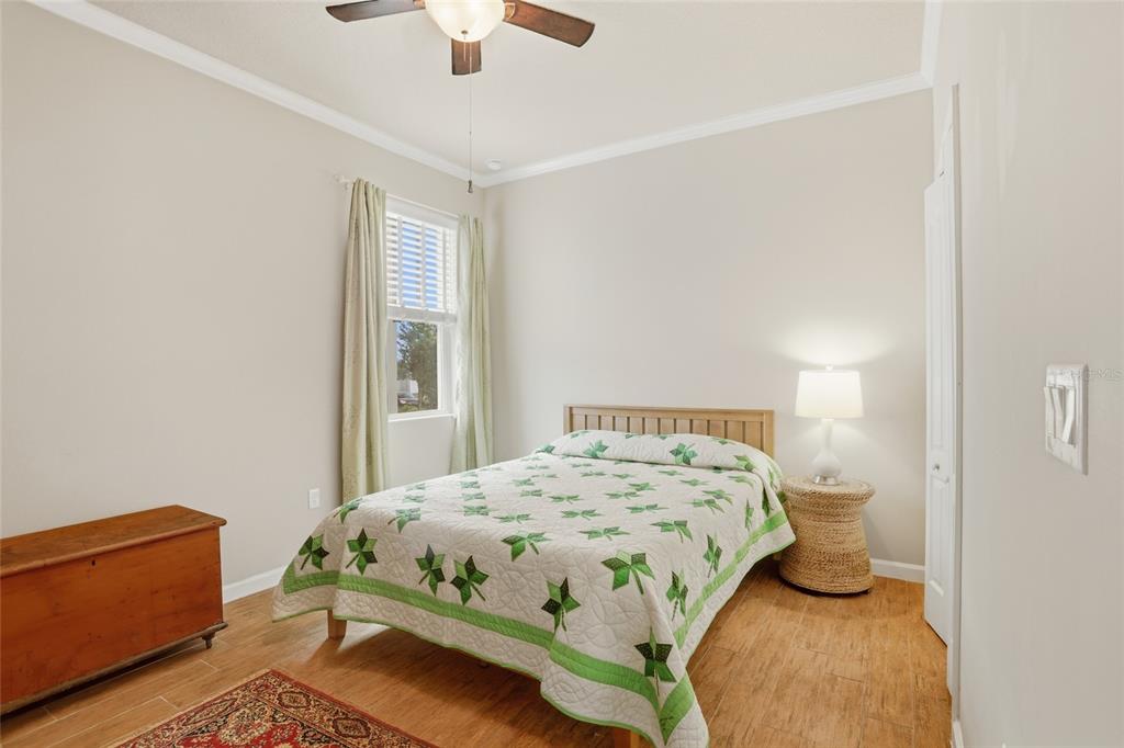 877 Haring Lane Mount Dora, FL 32757 - Photo 16 of 26 a bedroom with a bed and window