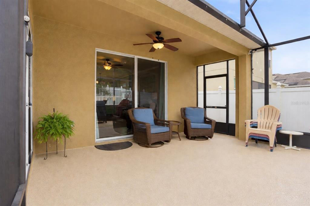 877 Haring Lane Mount Dora, FL 32757 - Photo 18 of 26 a lobby with furniture and potted plants