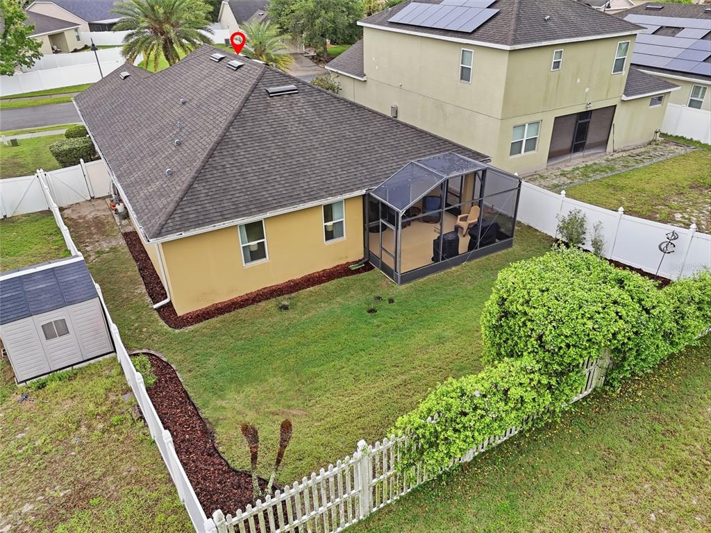 877 Haring Lane Mount Dora, FL 32757 - Photo 22 of 26 an aerial view of a house with garden