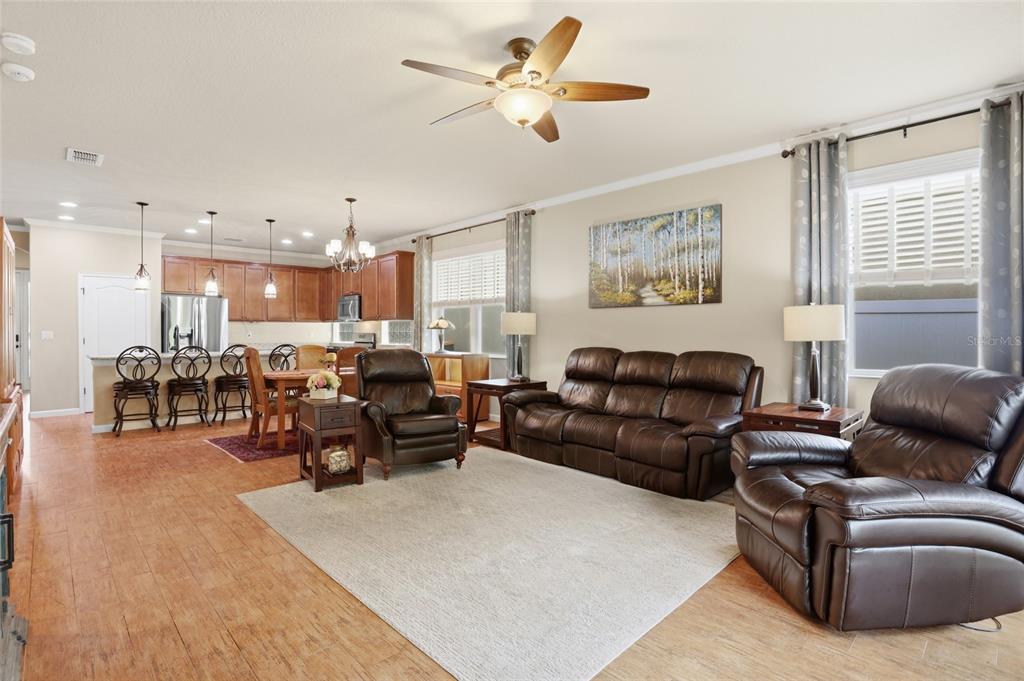 877 Haring Lane Mount Dora, FL 32757 - Photo 10 of 26 a living room with furniture kitchen area and a window