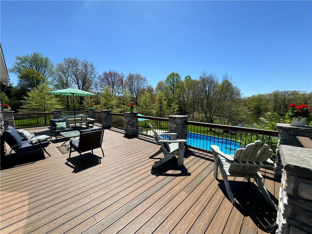 259 Old Mercer Road Volant, PA 16156 - Photo 8 of 45 a view of a roof deck with table and chairs a barbeque with wooden floor and fence