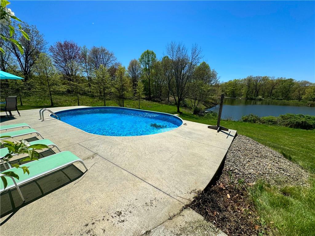 259 Old Mercer Road Volant, PA 16156 - Photo 10 of 45 a view of a swimming pool with a yard