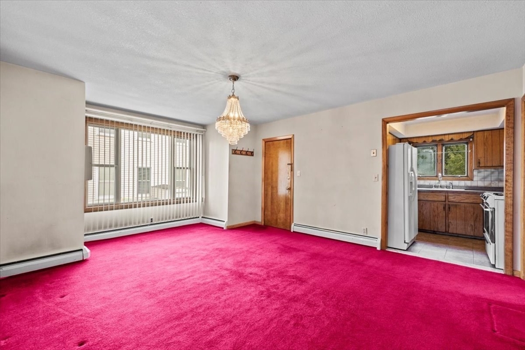 14 Grinnell Street Fall River, MA 02721 - Photo 13 of 41 wooden floor in an empty room with a window