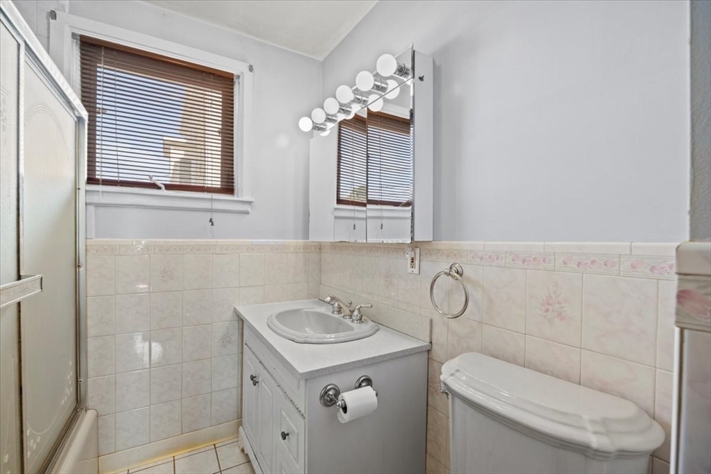14 Grinnell Street Fall River, MA 02721 - Photo 22 of 41 a bathroom with a granite countertop sink toilet and shower