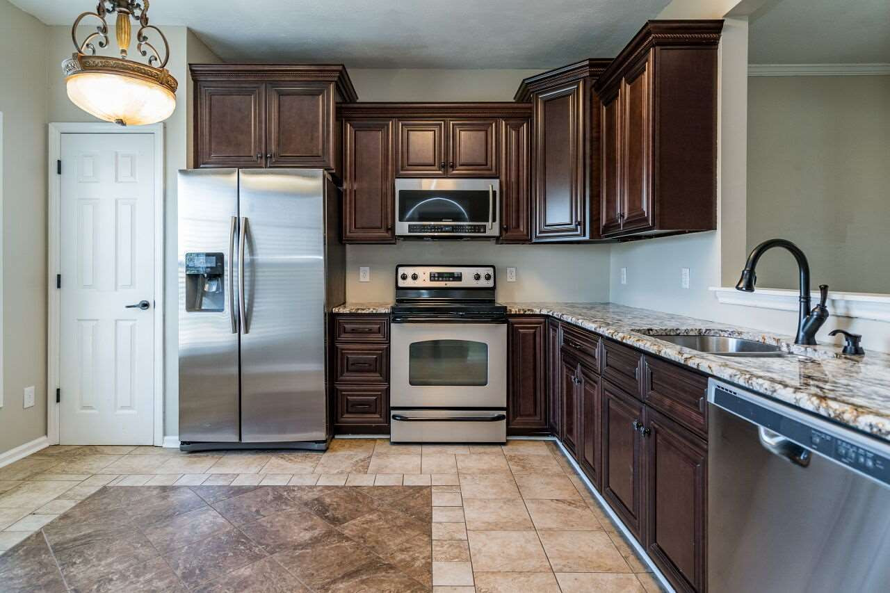 2905 Alder Ridge Lane Raleigh, NC 27603 - Photo 12 of 26 There is also a pantry for additional storage needs. Stainless appliances complete the package in this lovely space. Kitchen