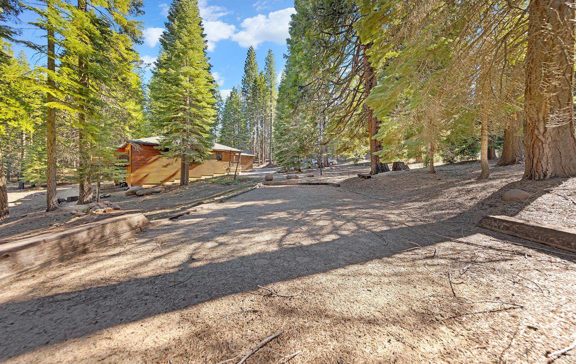 627 Deep Forest Road Lake Almanor, CA 96137 - Photo 27 of 29 a view of a backyard of a house