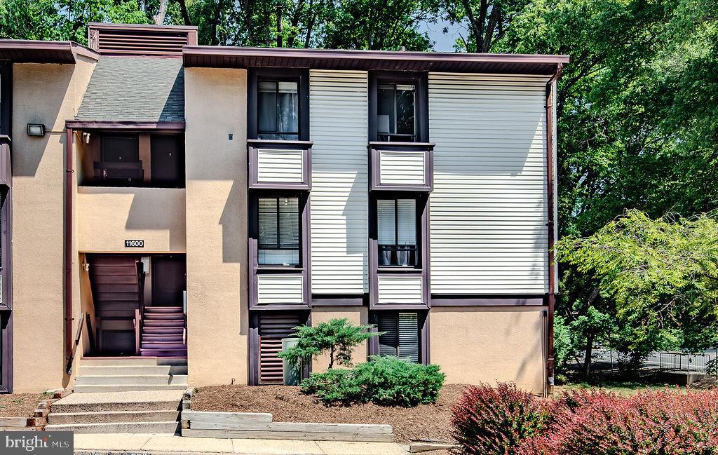 11600 Stoneview Square, Unit 60/2B Reston, VA 20191 - Photo 1 of 27 a view of a house with a patio