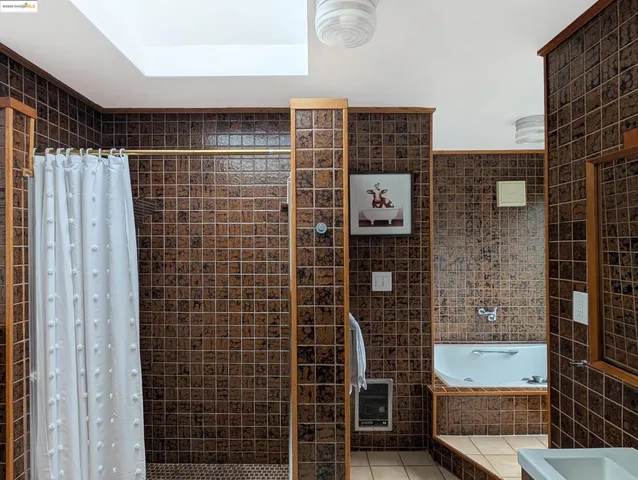 a bathroom with a bathtub and shower