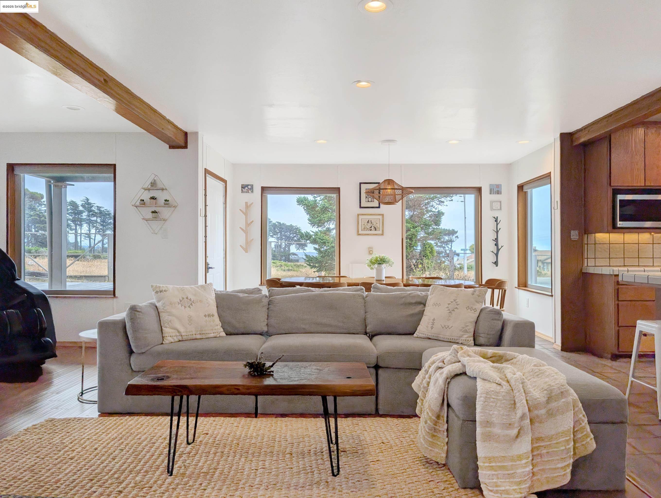 14771 Cypress Point Road Manchester, CA 95459 - Photo 2 of 36 a living room with furniture and a large window