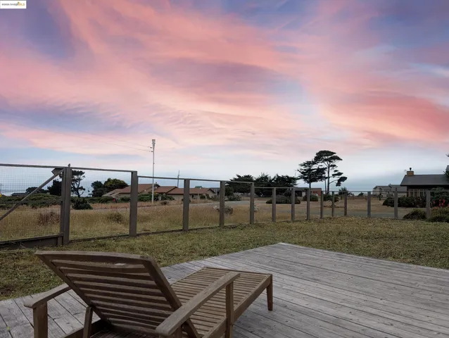 a view of sitting area in front of house