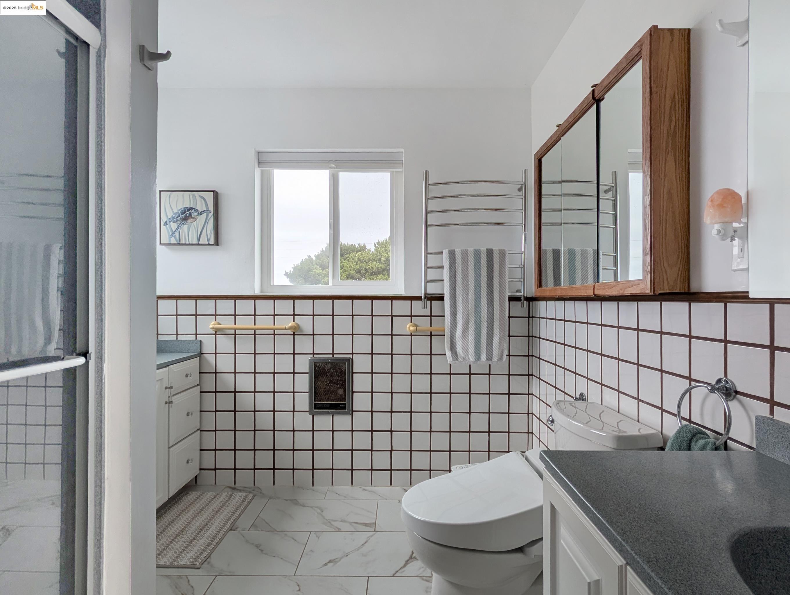 14771 Cypress Point Road Manchester, CA 95459 - Photo 29 of 36 a bathroom with a toilet sink and mirror