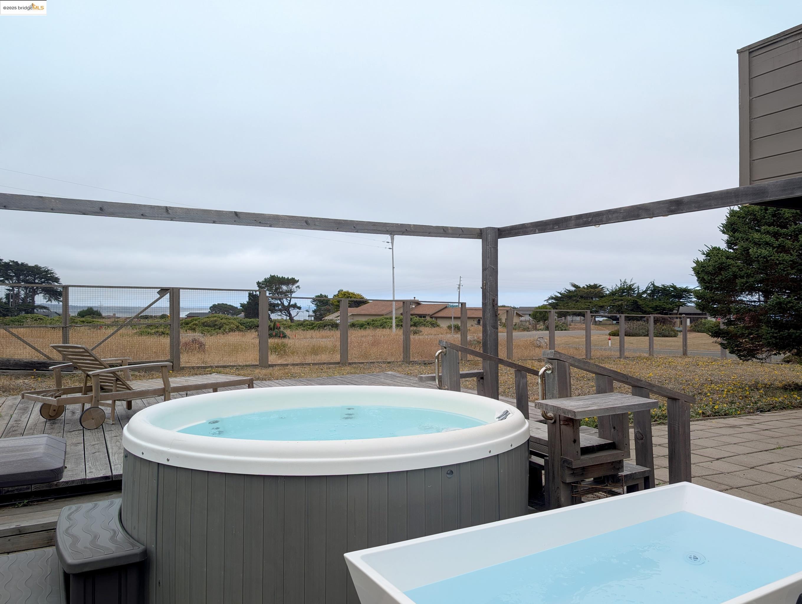 14771 Cypress Point Road Manchester, CA 95459 - Photo 34 of 36 Deck featuring a hot tub and a patio