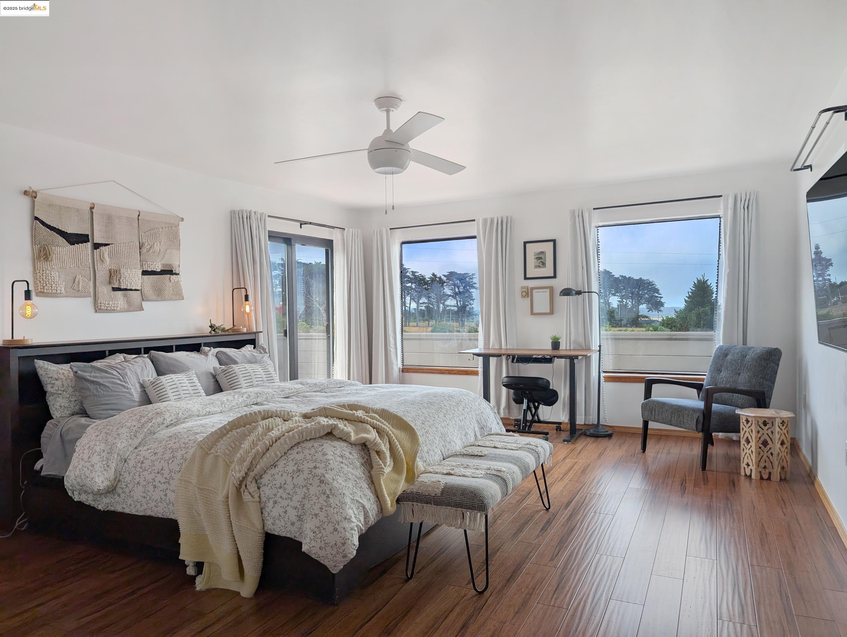 14771 Cypress Point Road Manchester, CA 95459 - Photo 10 of 36 Bedroom with wood finished floors, ceiling fan, and access to outside