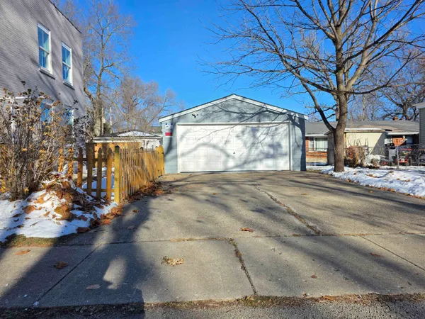 a kitchen with stainless steel appliances a stove a microwave and sink