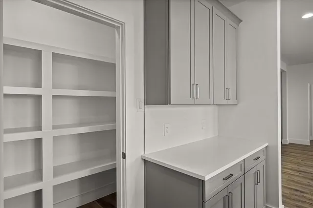 a room with a cabinets and a window