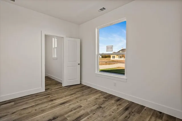 a view of an empty room and window