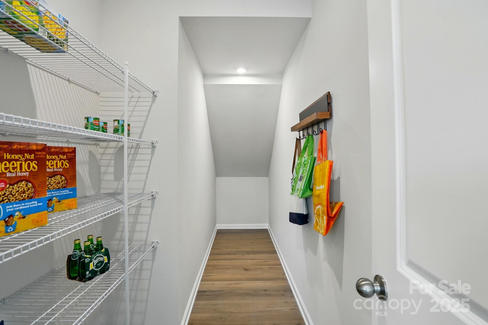 331 Laura Elizabeth Lane Clover, SC 29710 - Photo 12 of 31 a view of a hallway with wooden floor and furniture