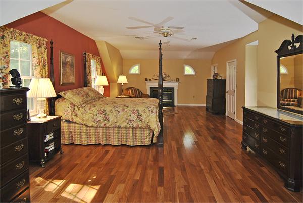 34 Grey Rock Road Bedford, NH 03110 - Photo 12 of 27 a bed room with a bed and wooden floor